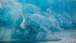 Fine art photography print of a Blue iceberg floating in the North Atlantic off the coast of Iceland.