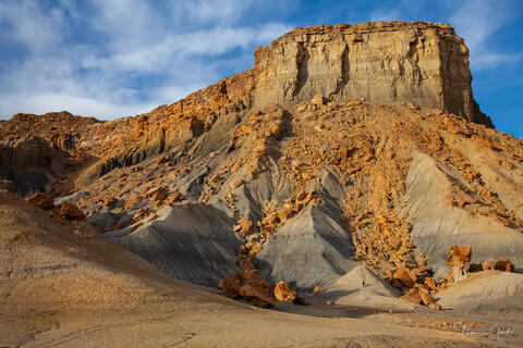 Fine art photograph of Nipple Bench in Utah with dramatic rock textures and blue sky by Tamara Gooch.