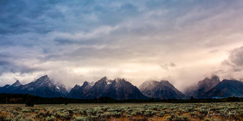"Grand Teton storm clouds fine art print with dramatic lighting over mountain peaks and sagebrush valley"

