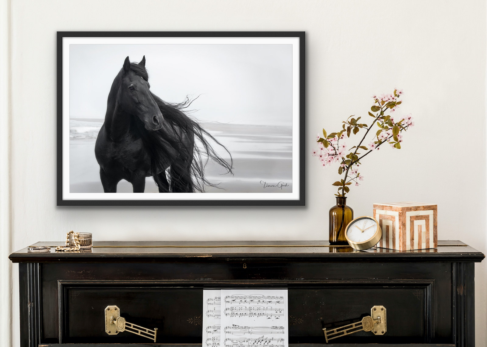 A fine art limited edition print of a Friesian horse on the beach done in black and white, shown framed on Lumachrome TruLife Acrylic. 